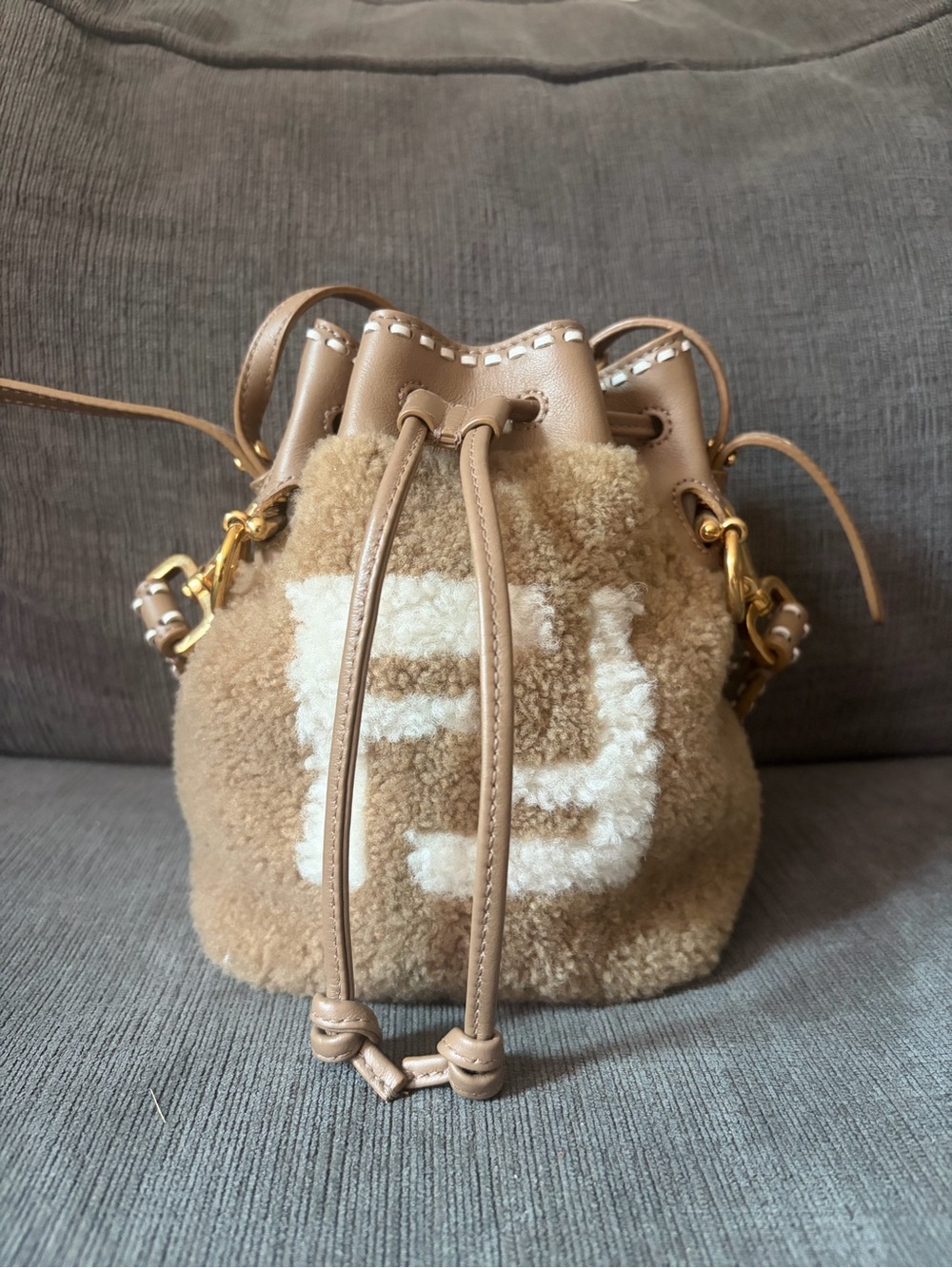 Fendi Beige Shearling Mini Drawstring Bucket Bag with White Logo